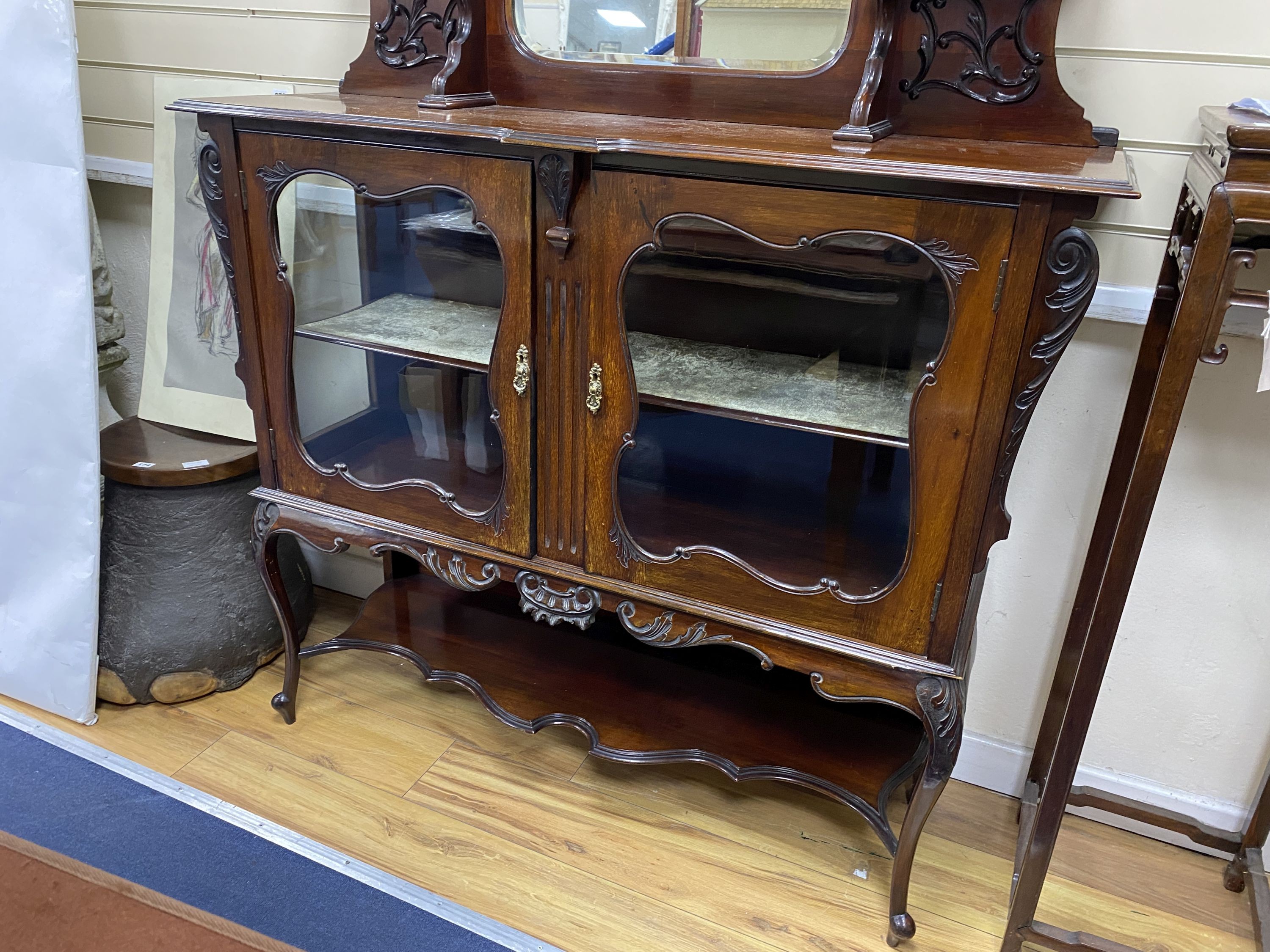A late Victorian mahogany mirrored back side cabinet, width 122cm, depth 36cm, height 202cm